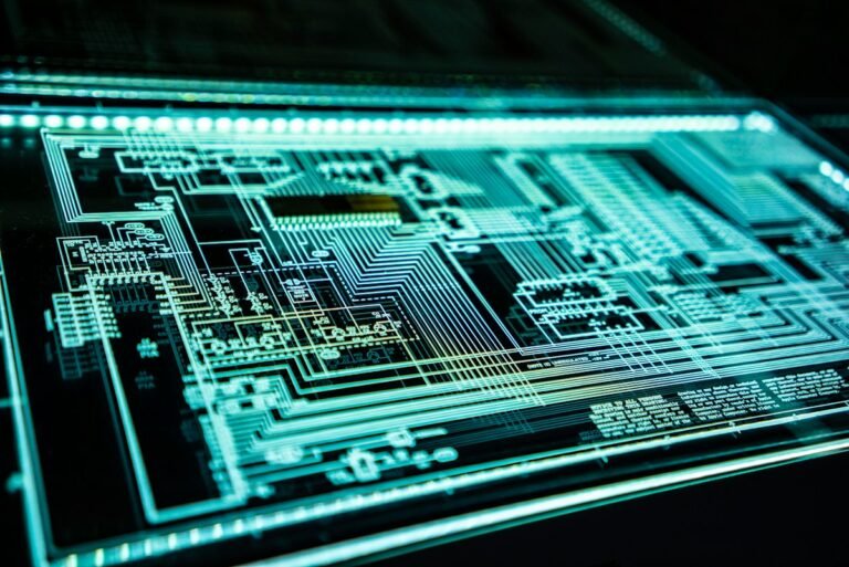 A teal-lit circuit panel representing quantum computing hardware