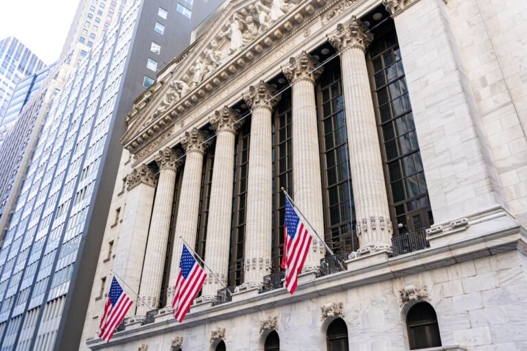 The New York Stock Exchange building with American flags